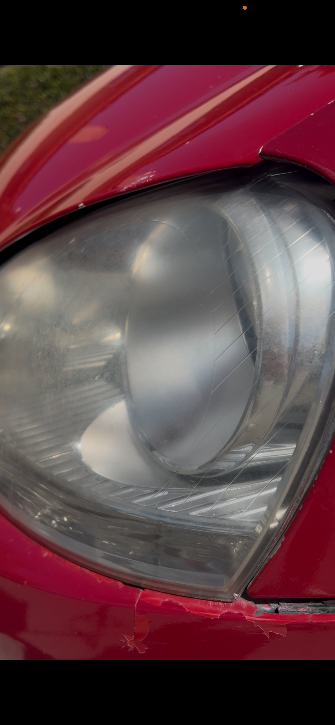 Foggy yellowed headlight before Night Bright restoration